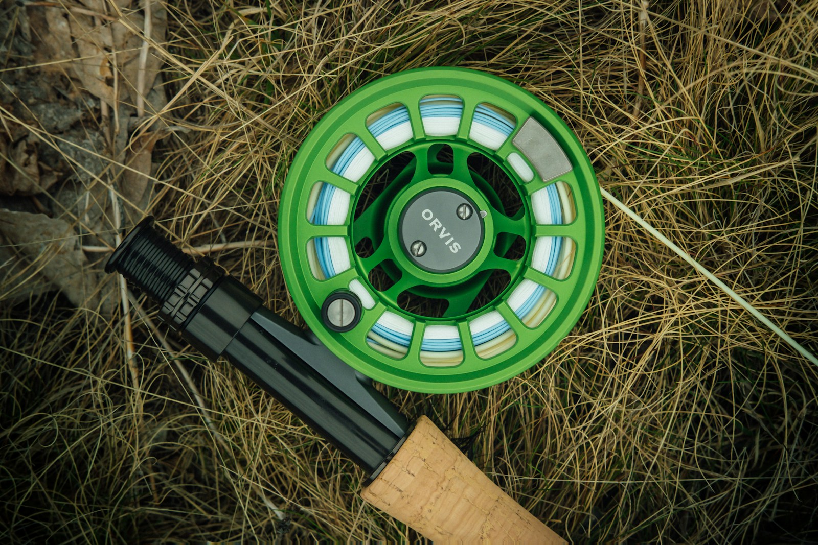 The Dog Bed Company Closing Locations, Apparently Also Sells Fly Rods a green fly fishing reel and a fly rod
