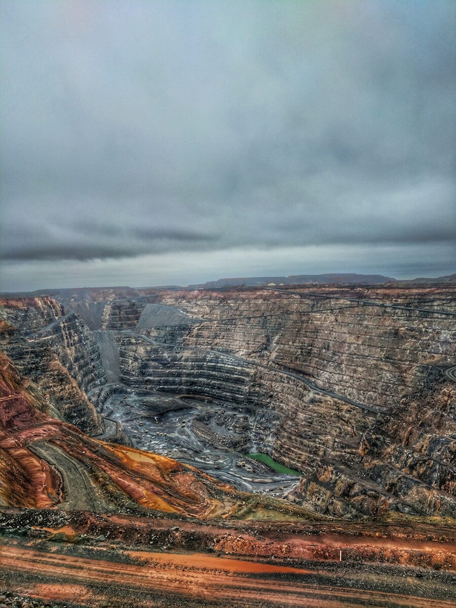 The Dirty Side of Electric Vehicles a view of a large open pit in the middle of nowhere