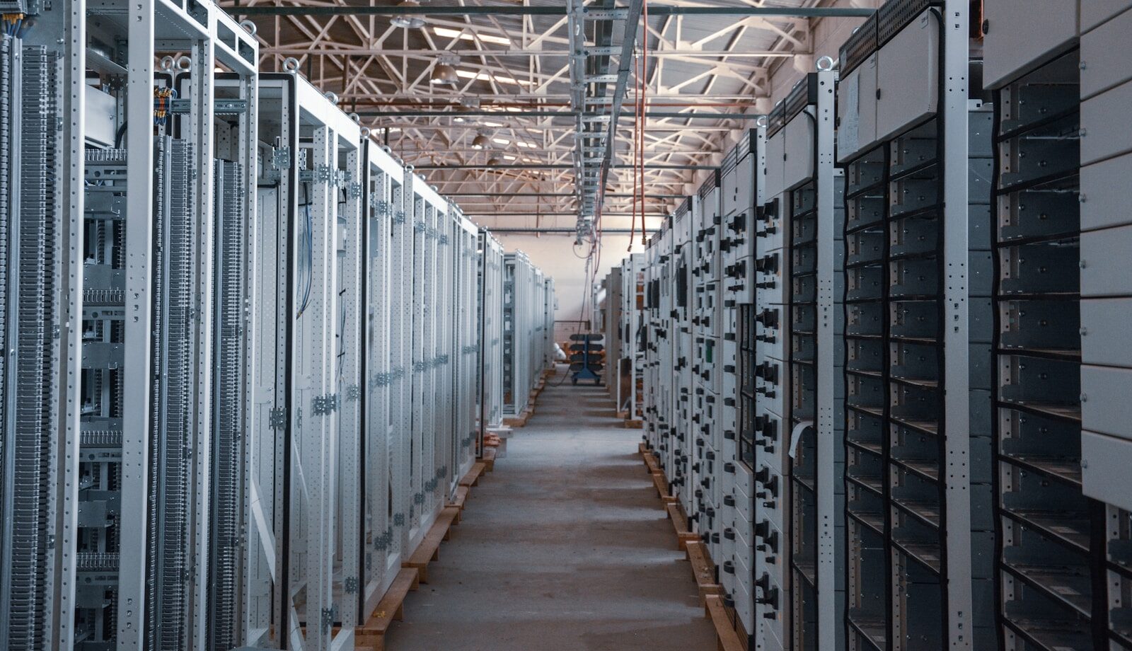 Large Tech Companies Are Buying Huge Pieces of Property for Data Centers and We Should All Be Concerned. brown wooden hallway with gray metal doors