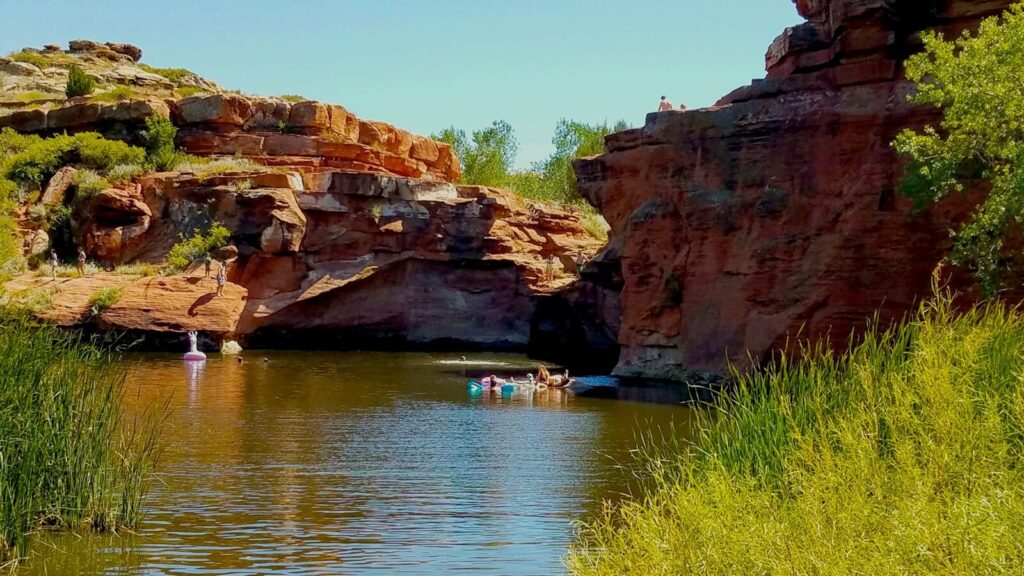 4 Natural Water Swim spots to Take Your Kids to in Texas: Safe, Scenic Family Adventures a group of people in a body of water